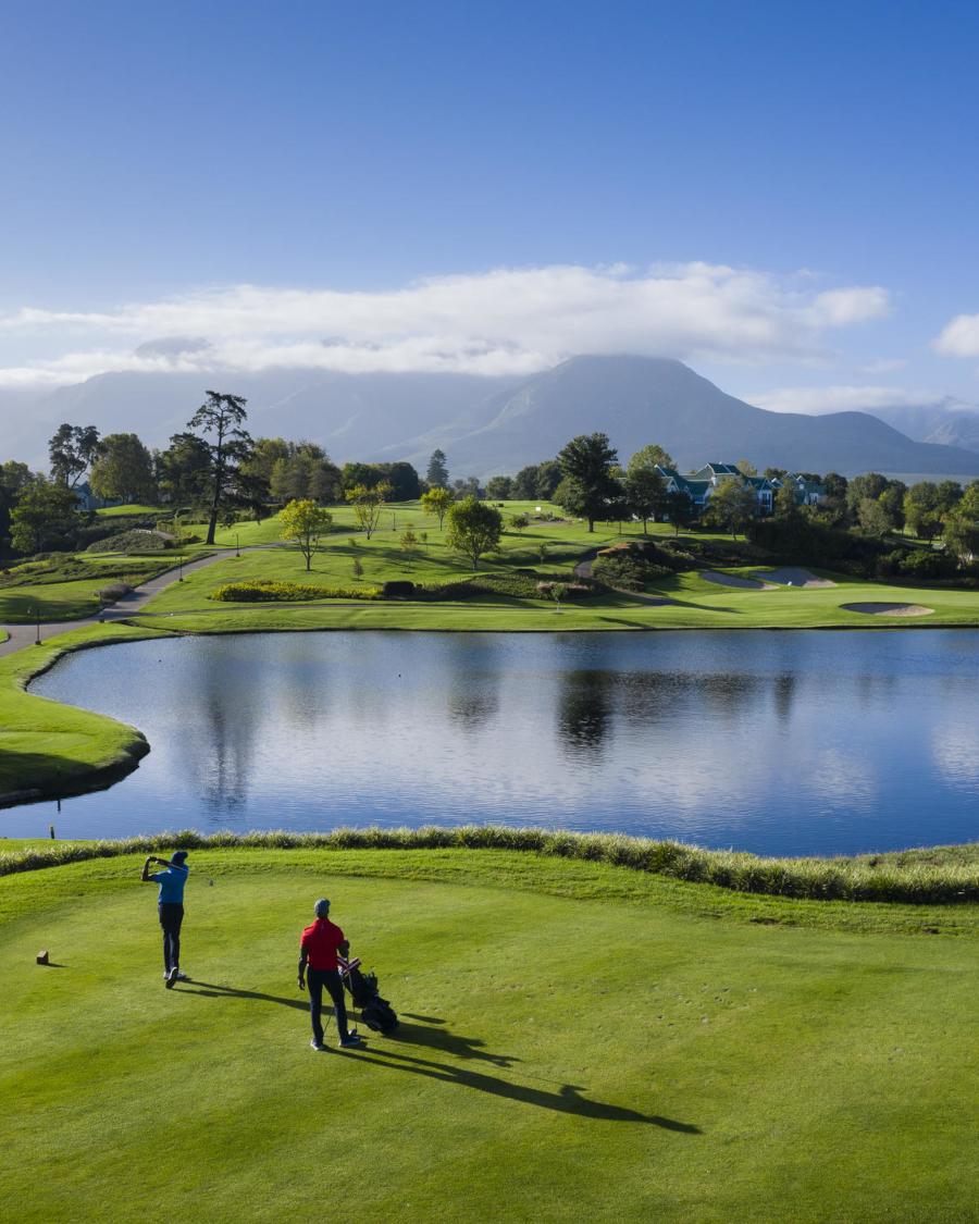 Fancourt golfers teeing off with mountains in the background